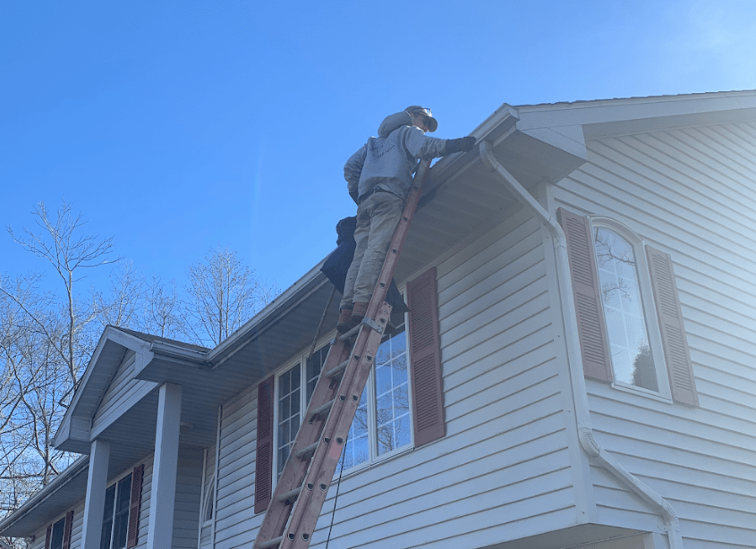 Cleaning gutter in Pleasantville, NY.